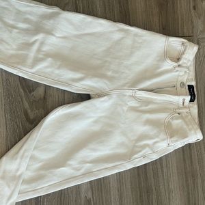 white pants with brown stitching